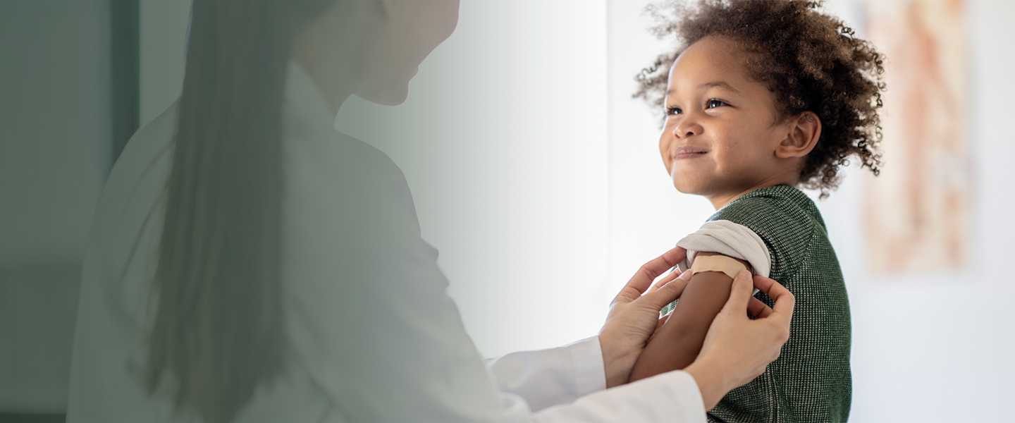 Child smiling at pediatrician